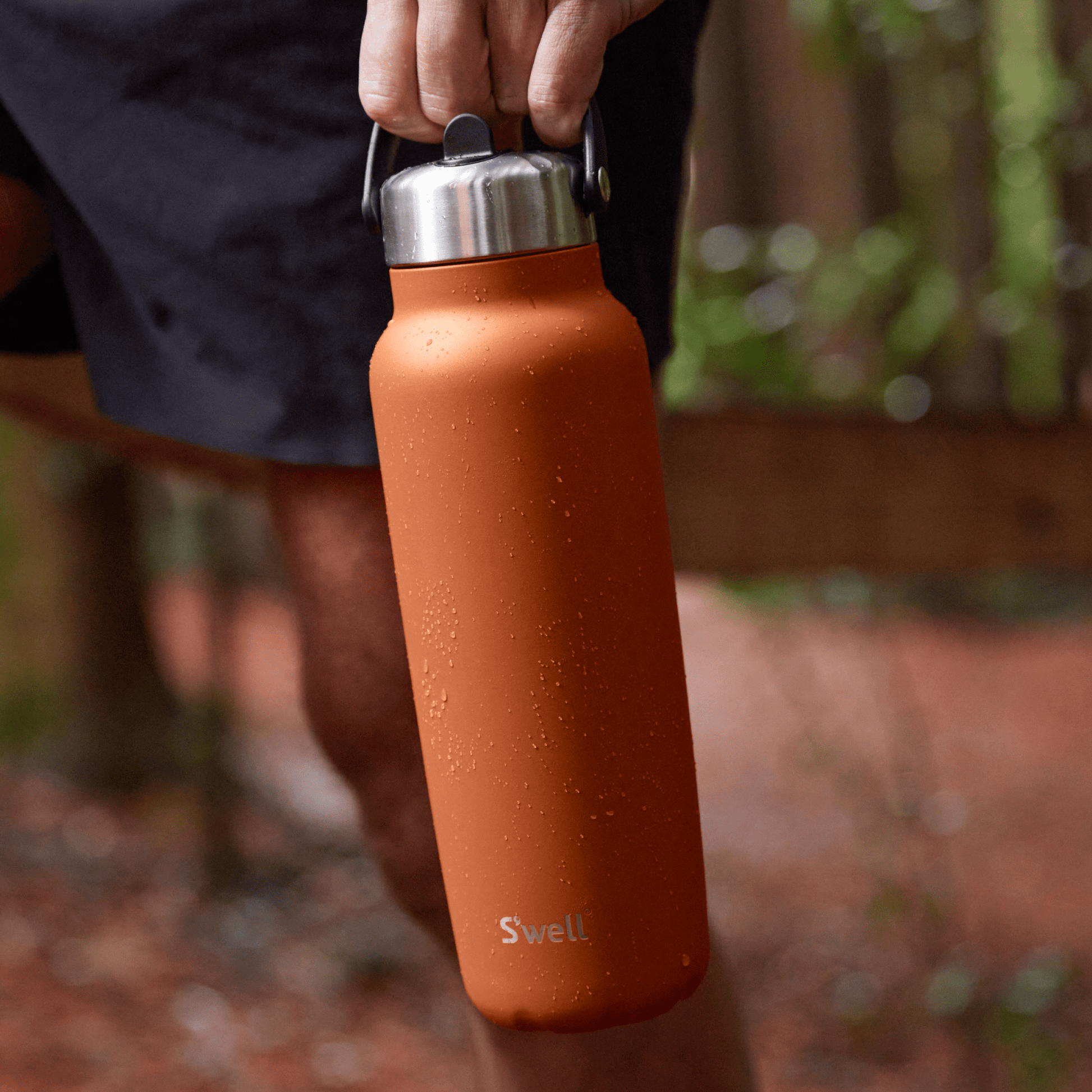 explorer-with-flip-straw-lid-40oz-e6 Swell-Explorer-Water-Bottle-40oz-Orange-Carnelian-LifeStyle.png